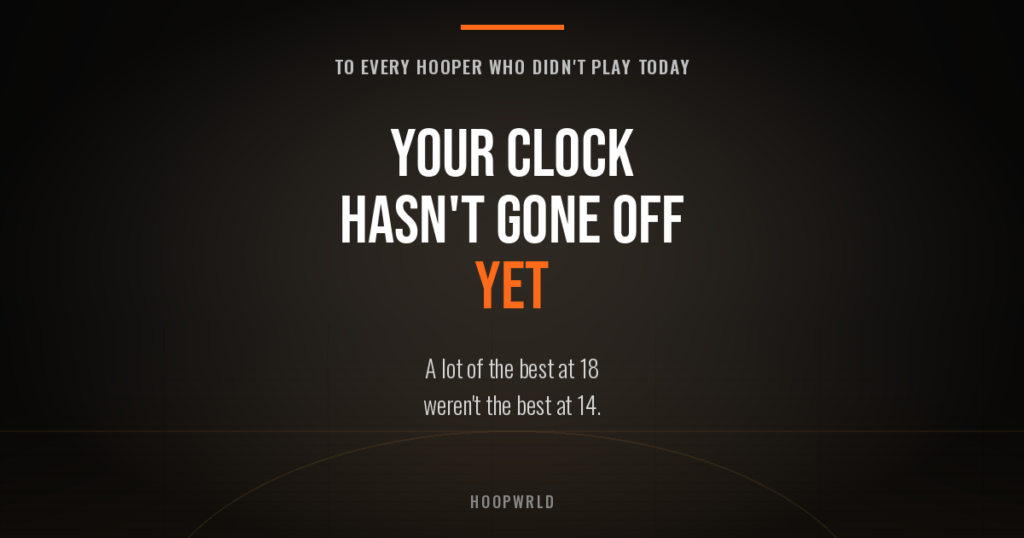 Dark empty basketball gym graphic reading "Your clock hasn't gone off yet" — for hoopers not getting playing time.